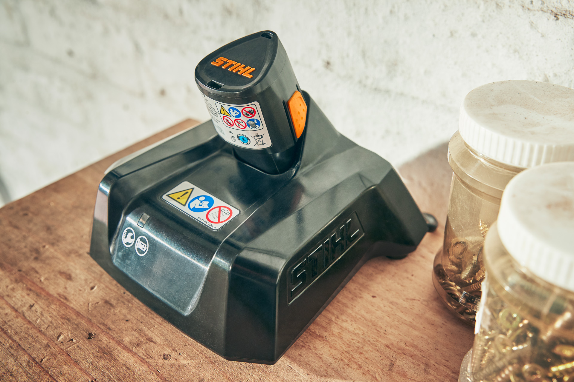 A STIHL AS 2 battery charging in a STIHL charger